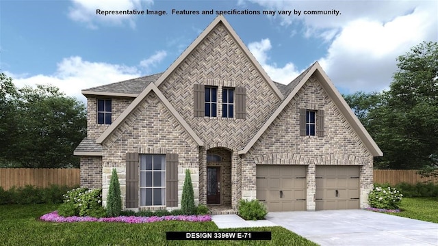 view of front of home with a front yard and a garage