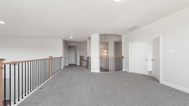 unfurnished room with recessed lighting, carpet flooring, visible vents, and baseboards