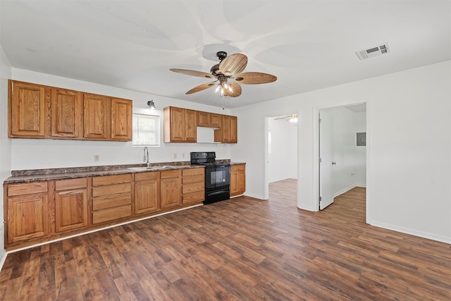 kitchen featuring black range with electric stovetop, ceiling fan, sink, and dark hardwood / wood-style floors