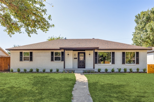 ranch-style home featuring a front yard