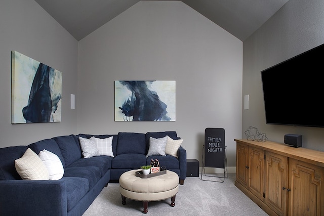 living room with light carpet and vaulted ceiling