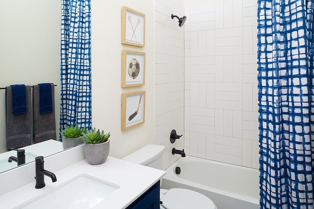 full bathroom featuring shower / bath combo with shower curtain, vanity, and toilet