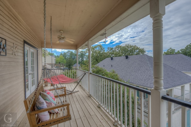 wooden terrace featuring ceiling fan