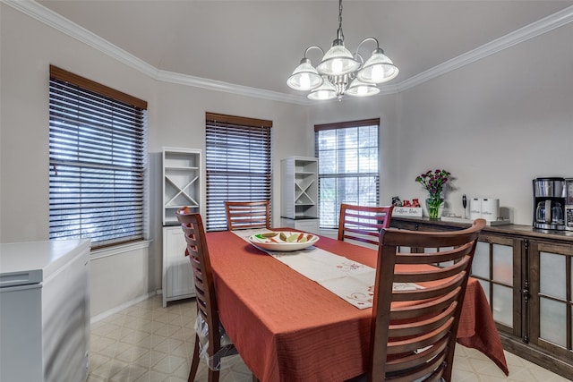 dining room featuring ornamental molding and a chandelier