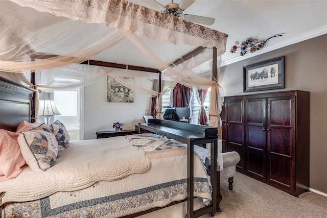 bedroom featuring ceiling fan, light colored carpet, and crown molding