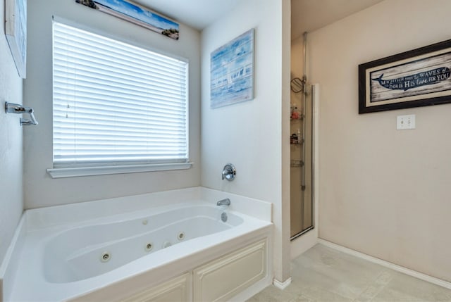 bathroom with shower with separate bathtub, tile patterned flooring, and plenty of natural light