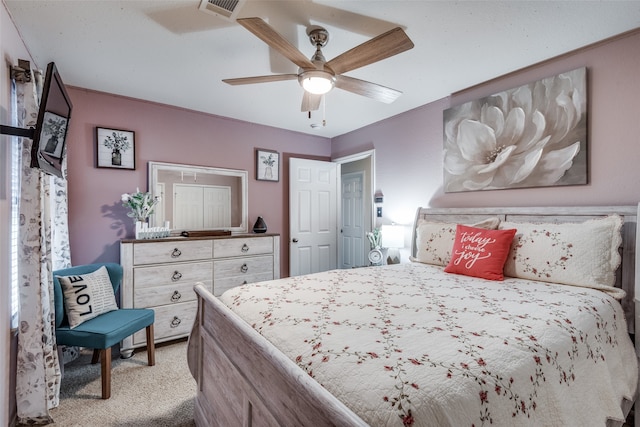 bedroom featuring ceiling fan and light colored carpet