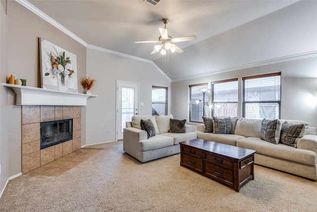 carpeted living room with ceiling fan, lofted ceiling, a fireplace, and ornamental molding