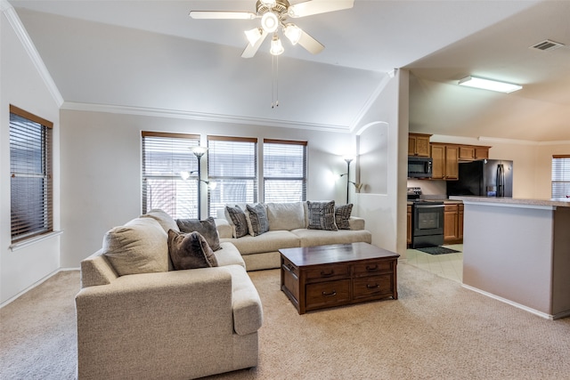 carpeted living room with lofted ceiling, ornamental molding, and ceiling fan