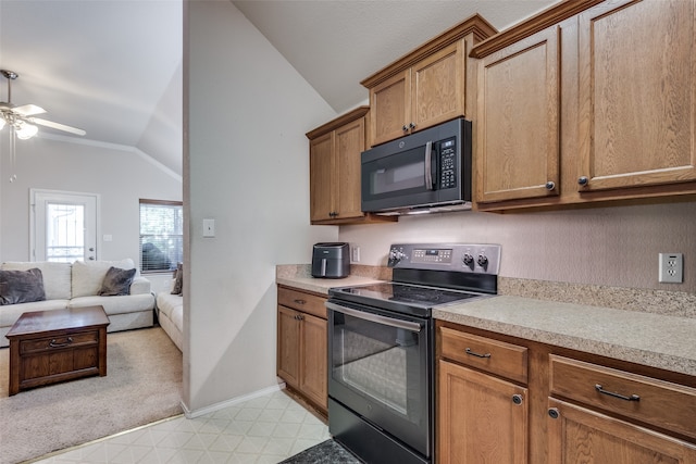 kitchen with black appliances, vaulted ceiling, and ceiling fan