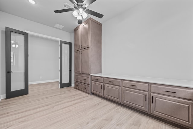 interior space featuring french doors, ceiling fan, and light hardwood / wood-style flooring