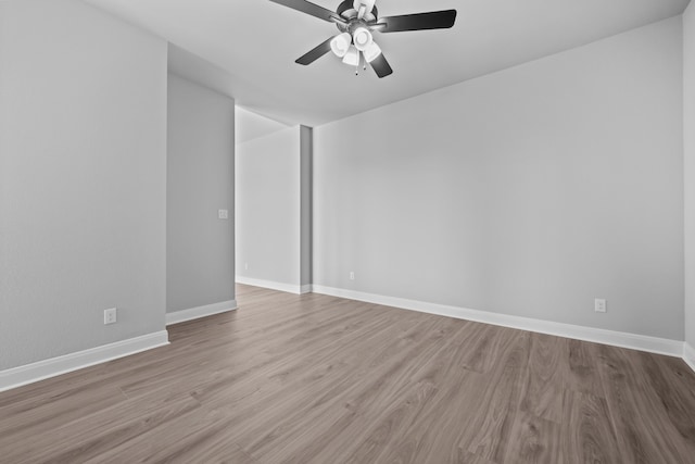 spare room with light hardwood / wood-style flooring and ceiling fan