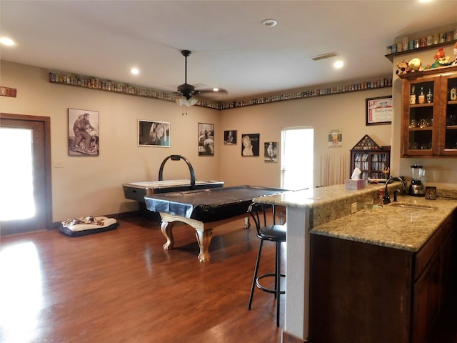 kitchen with dark wood-type flooring, billiards, kitchen peninsula, ceiling fan, and sink