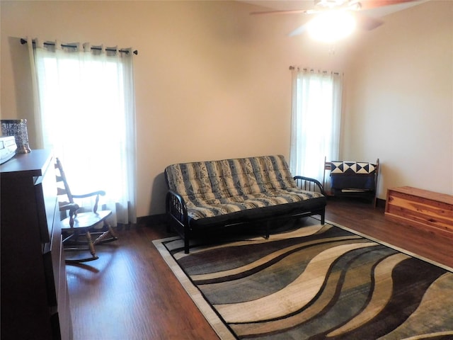 bedroom with ceiling fan and dark hardwood / wood-style floors