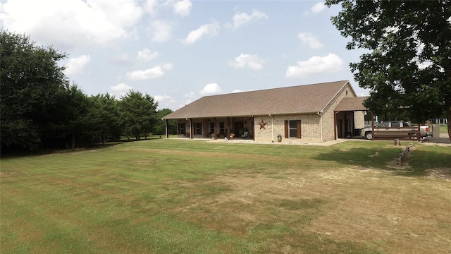 back of house with a yard