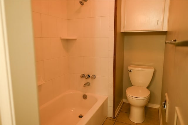 full bathroom featuring toilet, baseboards, shower / washtub combination, and tile patterned floors