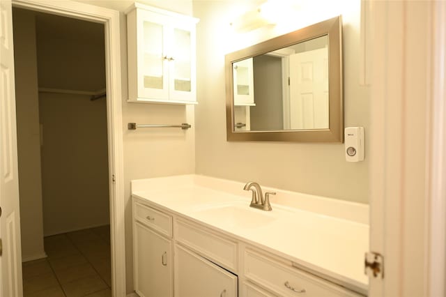 bathroom featuring tile patterned flooring and vanity