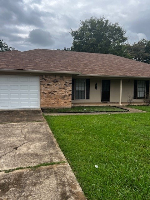 single story home with a front lawn and a garage