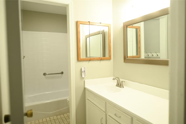 full bath with tile patterned flooring, vanity, and toilet