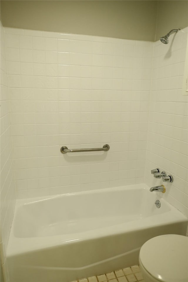 bathroom with toilet, shower / bathtub combination, and tile patterned floors