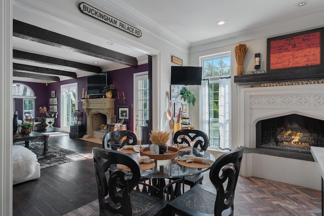 dining space with beam ceiling, dark hardwood / wood-style flooring, and ornamental molding