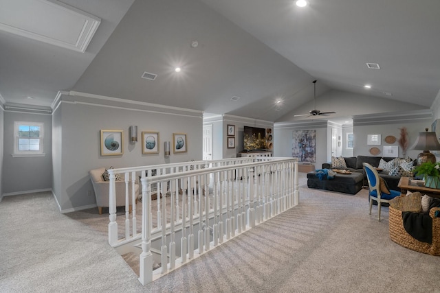 carpeted living room with crown molding, ceiling fan, and lofted ceiling