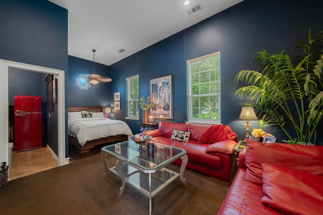 bedroom with refrigerator