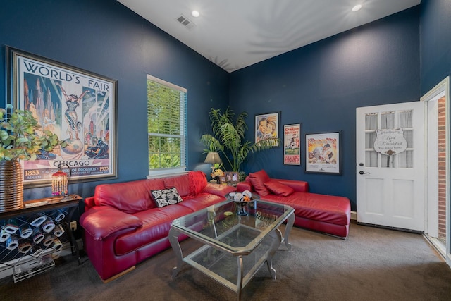 carpeted living room featuring vaulted ceiling