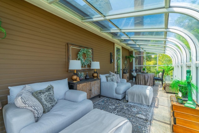 sunroom featuring vaulted ceiling