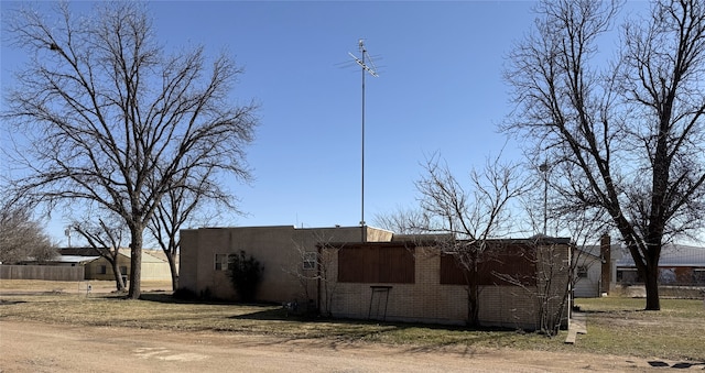 view of home's exterior with brick siding