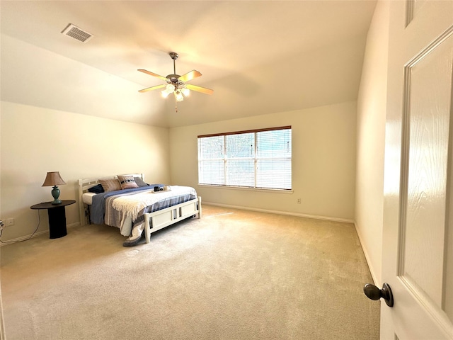 carpeted bedroom featuring vaulted ceiling and ceiling fan