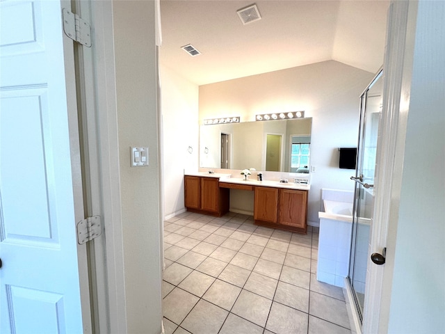 bathroom featuring vaulted ceiling, vanity, separate shower and tub, and tile patterned flooring