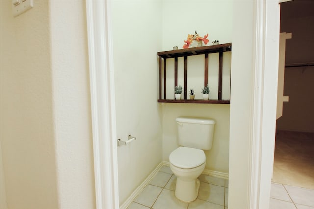 bathroom with tile patterned floors and toilet