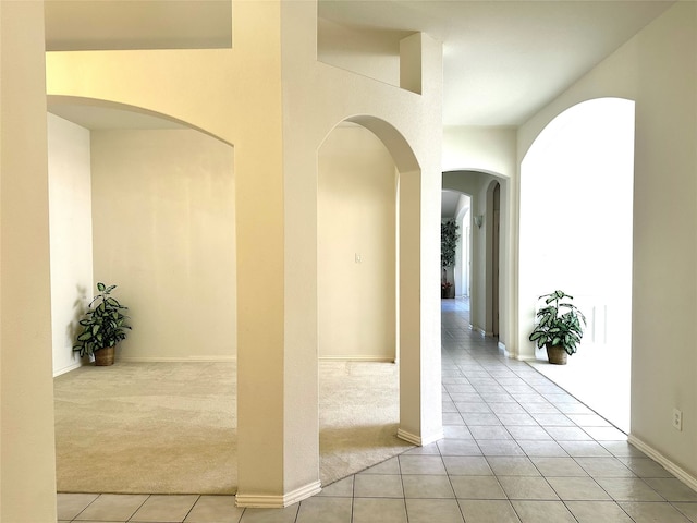 hallway featuring light carpet