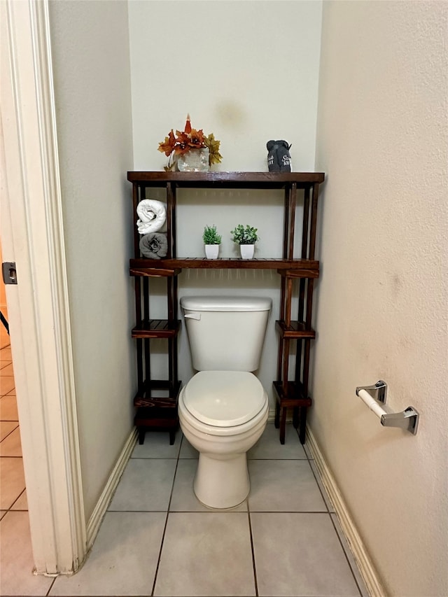 bathroom with tile patterned floors and toilet