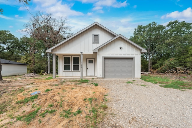 view of front of property featuring a garage and a porch