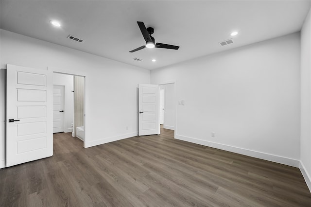 unfurnished bedroom featuring ceiling fan and dark hardwood / wood-style flooring