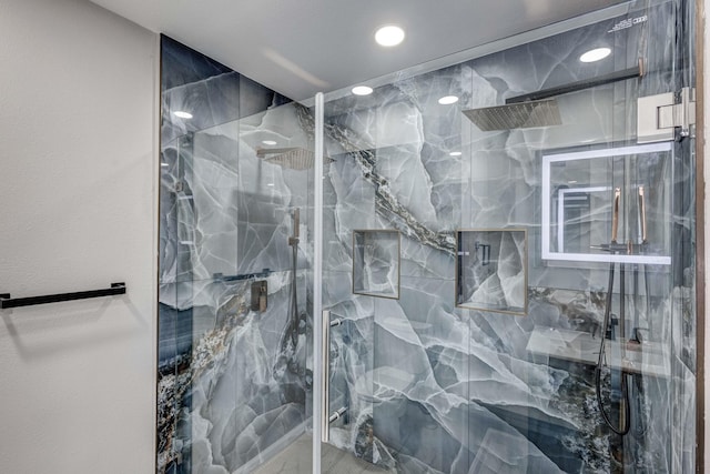 bathroom featuring recessed lighting and a marble finish shower
