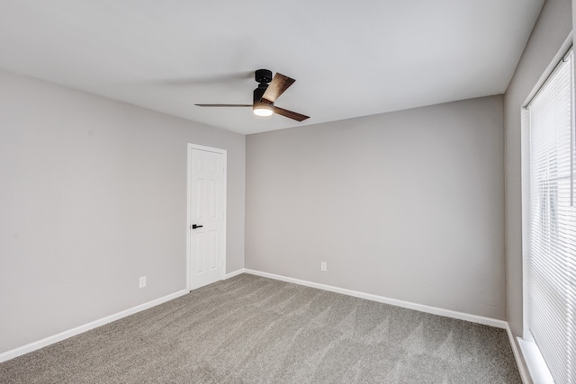 carpeted empty room with ceiling fan