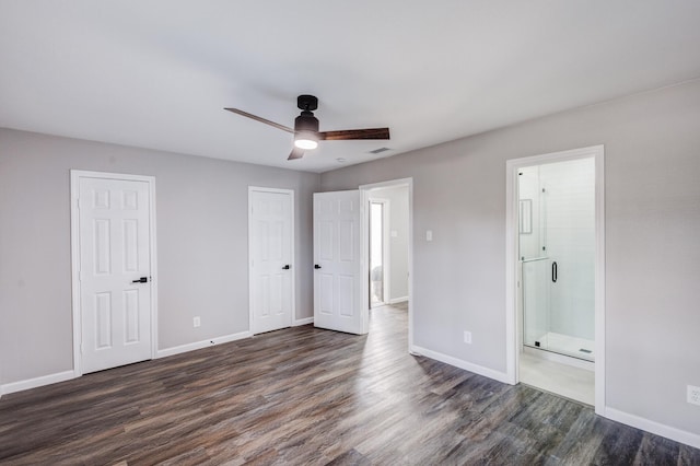 unfurnished bedroom featuring visible vents, baseboards, and dark wood finished floors