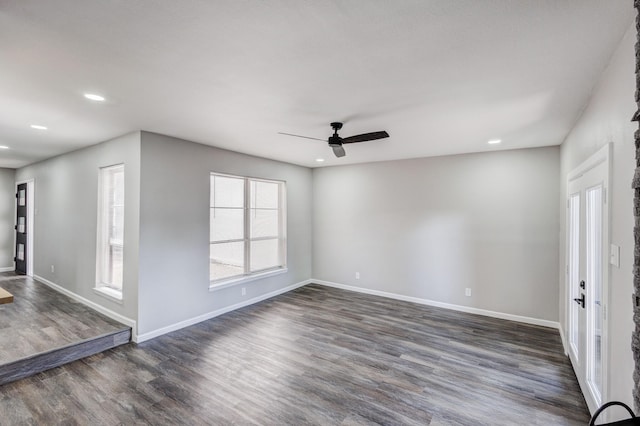 interior space featuring recessed lighting, baseboards, dark wood finished floors, and a ceiling fan
