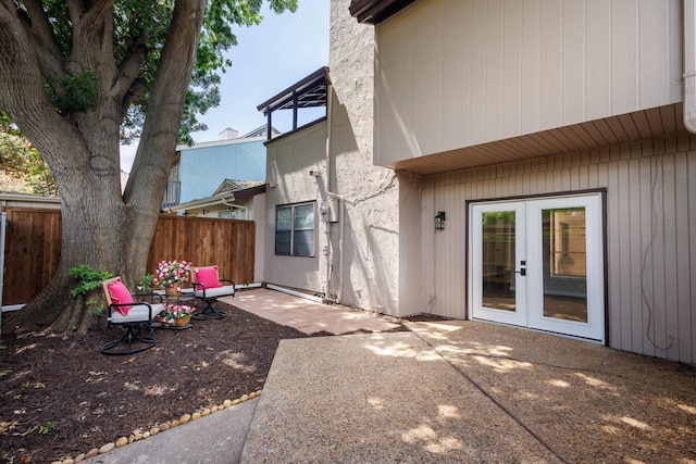 view of patio / terrace with fence and french doors