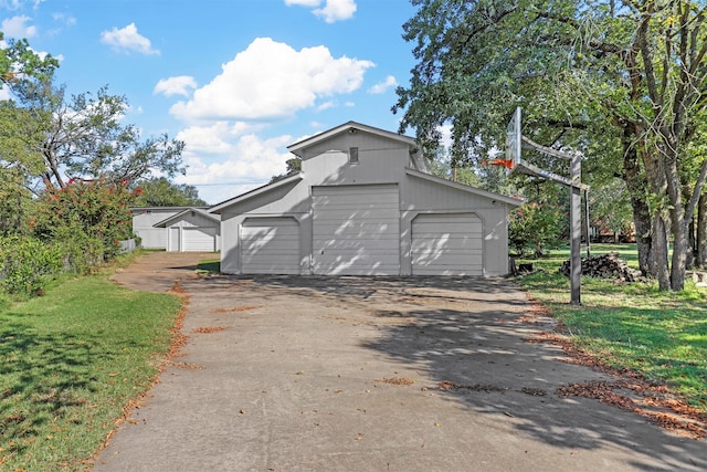 garage with a yard