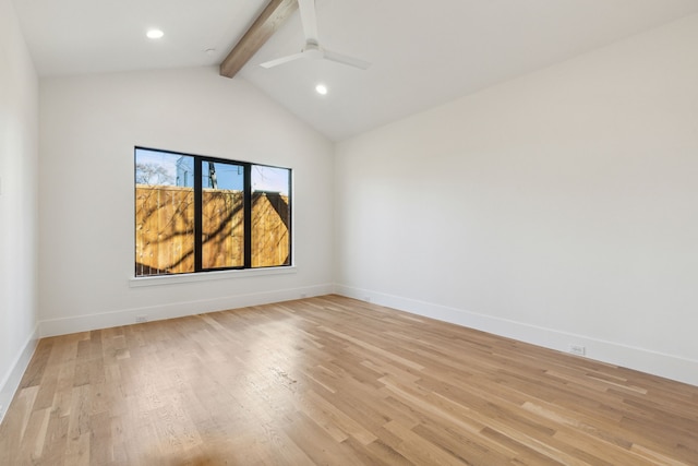 spare room with lofted ceiling with beams, light hardwood / wood-style floors, and ceiling fan