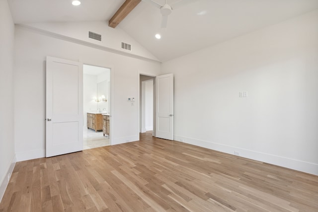 unfurnished bedroom with vaulted ceiling with beams, ceiling fan, ensuite bath, and light hardwood / wood-style floors