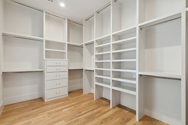 spacious closet featuring hardwood / wood-style flooring