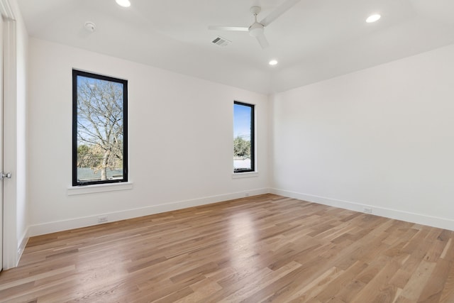 empty room featuring light hardwood / wood-style floors and ceiling fan