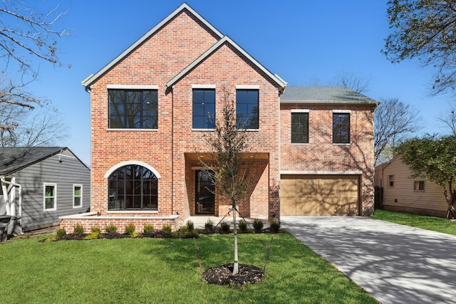 view of front property featuring a front yard and a garage