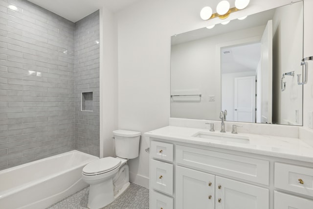 full bathroom featuring tiled shower / bath, tile patterned flooring, vanity, and toilet