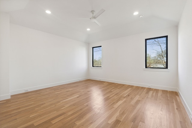 unfurnished room with light hardwood / wood-style floors, ceiling fan, and lofted ceiling